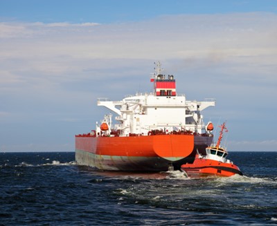 Escorting tanker by red tugs