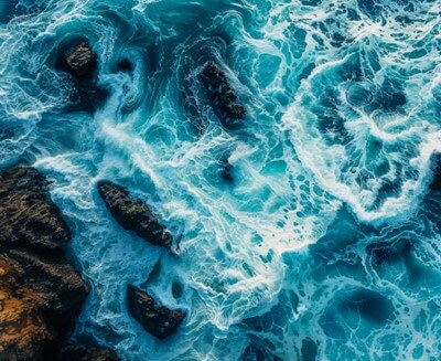 Waves hitting rocky shoreline